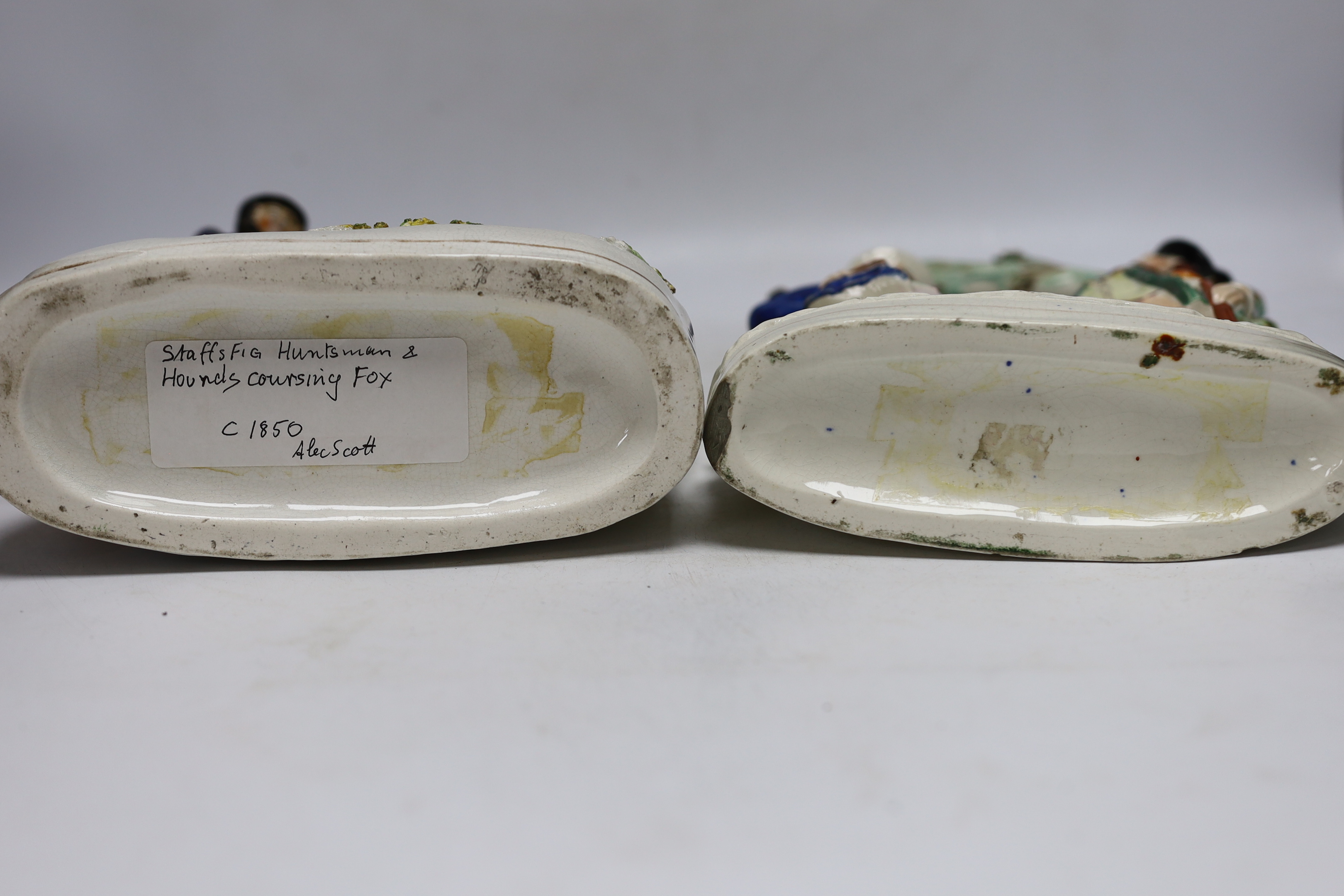 Two mid 19th century Staffordshire hunting figure groups and a pair of fox spill vases, 33cm